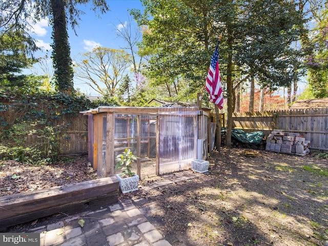 view of poultry coop featuring a fenced backyard