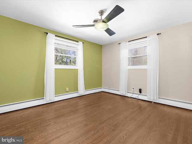 empty room featuring ceiling fan and wood finished floors