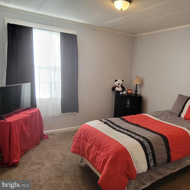 carpeted bedroom with crown molding, baseboards, and multiple windows