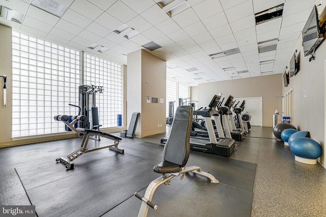 workout area featuring baseboards and visible vents