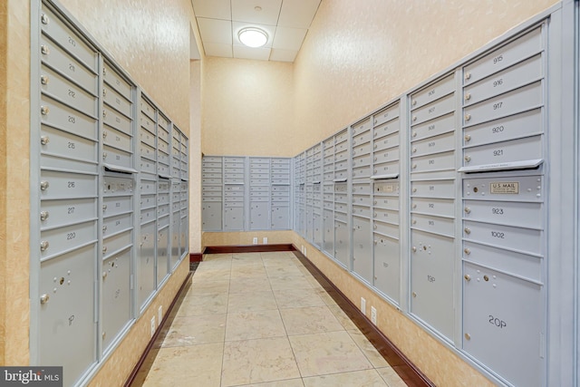 view of home's community featuring mail area