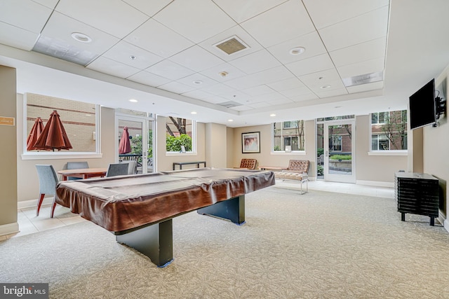 game room with a paneled ceiling, carpet flooring, and baseboards