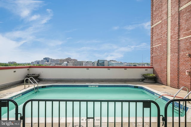 community pool featuring a city view
