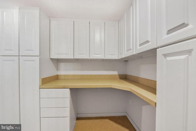 unfurnished office featuring built in study area