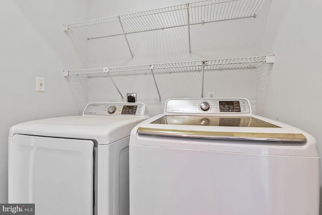 laundry room with washer and clothes dryer and laundry area