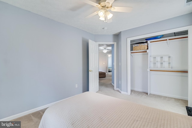 bedroom with a closet, carpet flooring, and baseboards