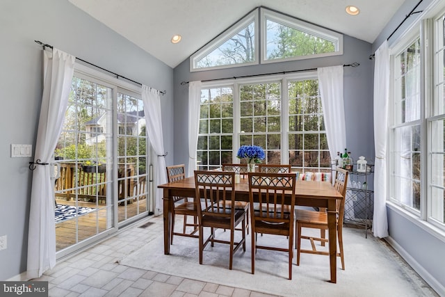 dining space with recessed lighting, visible vents, baseboards, and vaulted ceiling