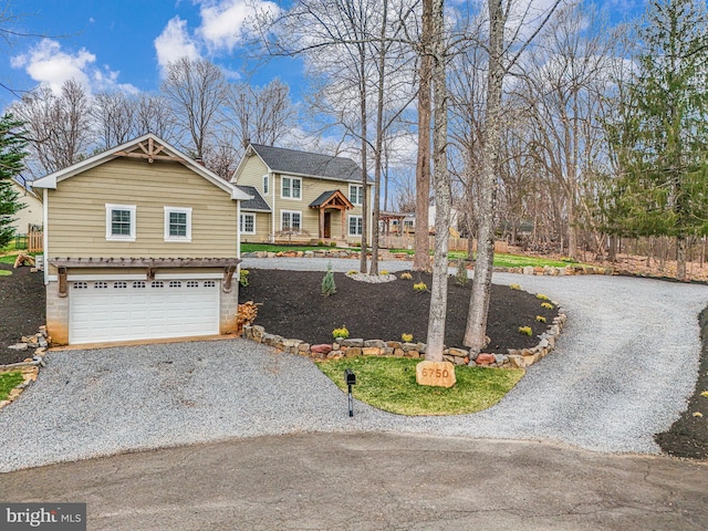 6750 Stonehurst Ct, Warrenton, VA 20187 - view of front of house with gravel driveway and a garage