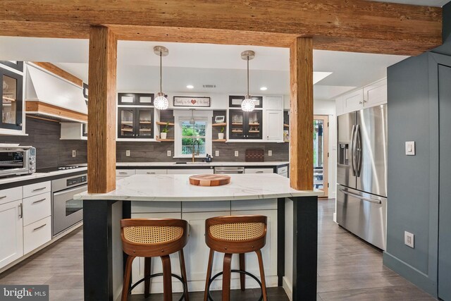 6750 Stonehurst Ct, Warrenton, VA 20187 - kitchen with appliances with stainless steel finishes, tasteful backsplash, dark wood-style floors, white cabinets, and recessed lighting
