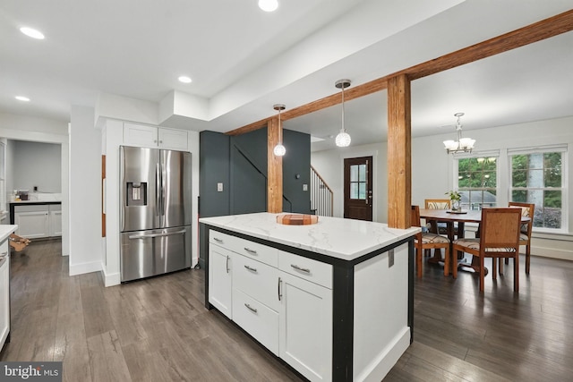 6750 Stonehurst Ct, Warrenton, VA 20187 - kitchen featuring stainless steel fridge with ice dispenser, dark wood-type flooring, light stone counters, white cabinetry, and decorative light fixtures