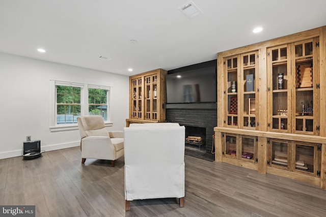 6750 Stonehurst Ct, Warrenton, VA 20187 - living area with a fireplace, wood finished floors, recessed lighting, and baseboards