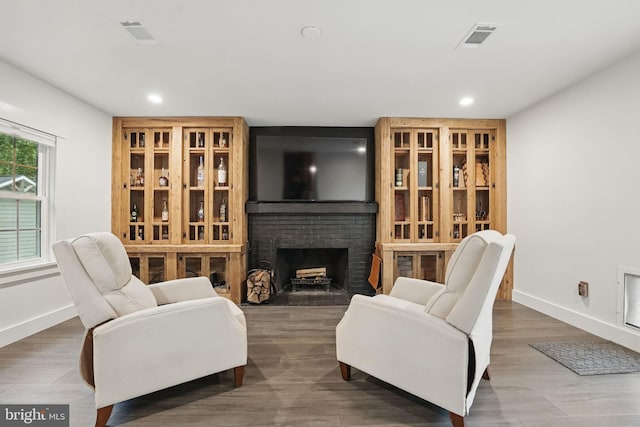 6750 Stonehurst Ct, Warrenton, VA 20187 - living room featuring baseboards, recessed lighting, a brick fireplace, and wood finished floors