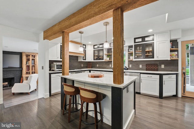 6750 Stonehurst Ct, Warrenton, VA 20187 - kitchen with open shelves, dark wood-type flooring, decorative backsplash, white cabinets, and beamed ceiling