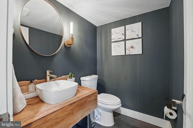 6750 Stonehurst Ct, Warrenton, VA 20187 - bathroom featuring toilet, vanity, and wood finished floors