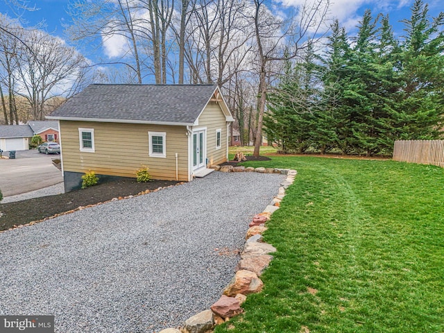 6750 Stonehurst Ct, Warrenton, VA 20187 - view of side of property with a shingled roof and gravel driveway