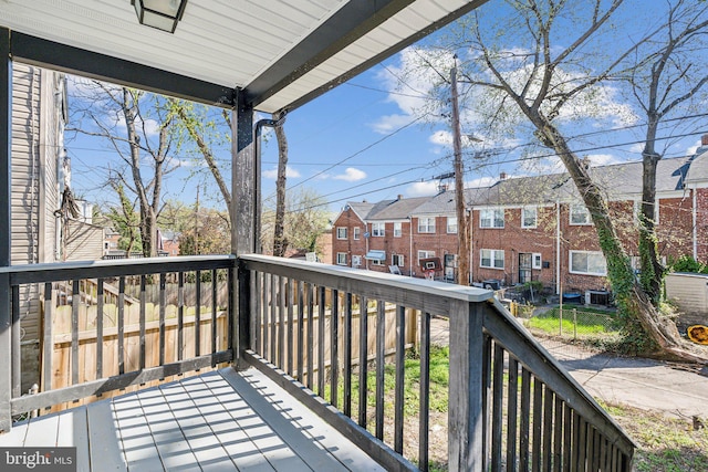 wooden deck with a residential view