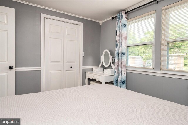 421 Burbank Ct, Baltimore, MD 21227 - bedroom featuring crown molding and a closet