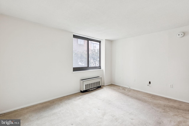 1420 Locust St Unit 6Q, Philadelphia, PA 19102 - spare room featuring a smoke detector and carpet flooring