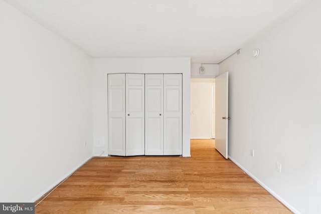 1420 Locust St Unit 6Q, Philadelphia, PA 19102 - unfurnished bedroom with light wood-style flooring and a closet