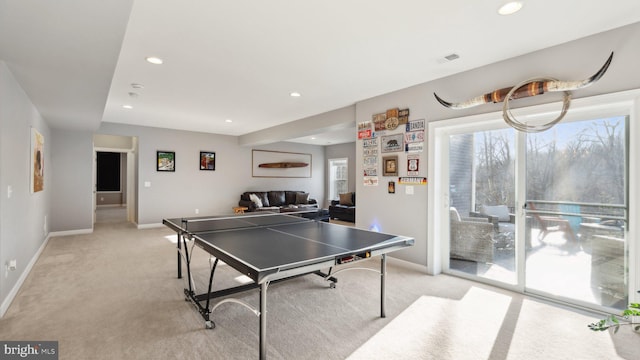rec room featuring visible vents, baseboards, recessed lighting, and light colored carpet