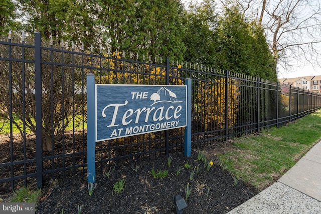view of property's community featuring fence