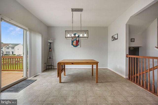 720 Birch Tree Ln, Smyrna, DE 19977 - dining space with stairway, tile patterned flooring, and baseboards