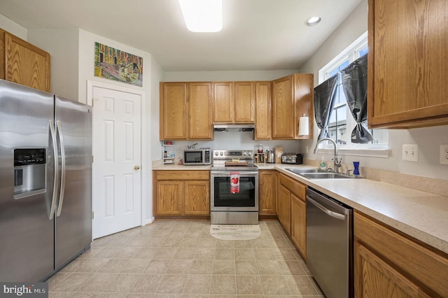 720 Birch Tree Ln, Smyrna, DE 19977 - kitchen with appliances with stainless steel finishes, a sink, extractor fan, light countertops, and recessed lighting