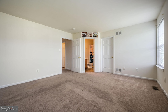 720 Birch Tree Ln, Smyrna, DE 19977 - unfurnished bedroom with carpet flooring, multiple windows, and baseboards