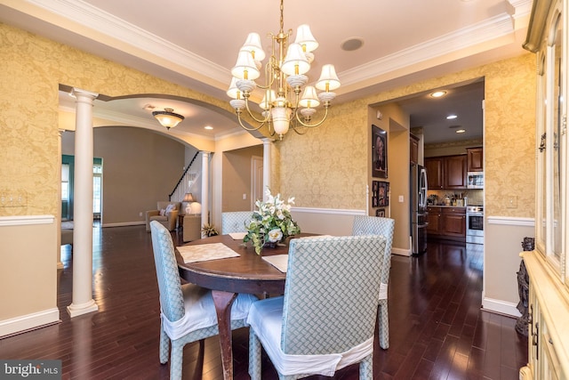 14 Komen Ct, Sellersville, PA 18960 - dining room with wallpapered walls, an inviting chandelier, dark wood finished floors, and decorative columns