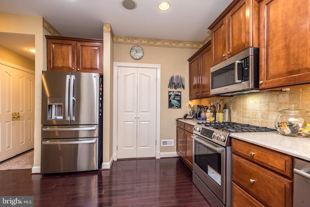 14 Komen Ct, Sellersville, PA 18960 - kitchen with light countertops, dark wood-type flooring, visible vents, decorative backsplash, and appliances with stainless steel finishes