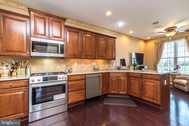 14 Komen Ct, Sellersville, PA 18960 - kitchen with backsplash, light countertops, a peninsula, and stainless steel appliances
