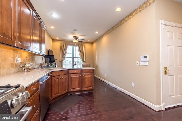 14 Komen Ct, Sellersville, PA 18960 - kitchen with dark wood-type flooring, a peninsula, stainless steel appliances, baseboards, and backsplash