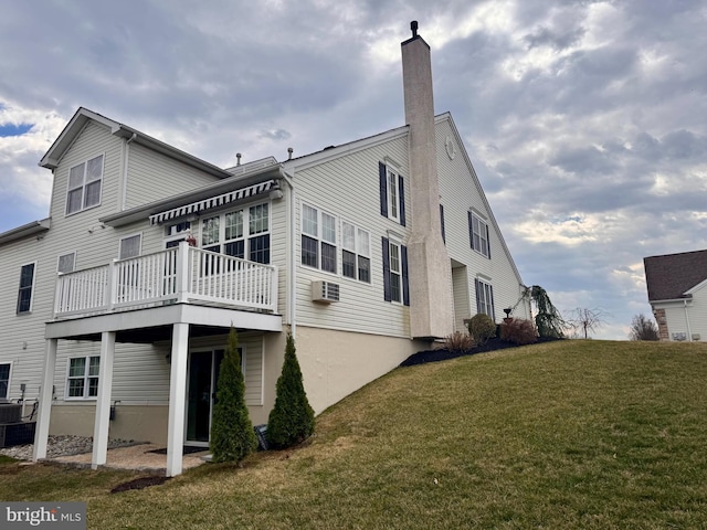 14 Komen Ct, Sellersville, PA 18960 - back of house with a yard, a wall unit AC, and a chimney