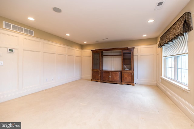14 Komen Ct, Sellersville, PA 18960 - unfurnished room featuring a decorative wall, visible vents, recessed lighting, and light colored carpet