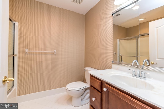 14 Komen Ct, Sellersville, PA 18960 - bathroom with vanity, a shower with door, toilet, tile patterned floors, and baseboards