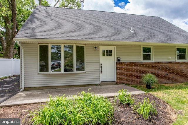 1102 Dolores Ln, Croydon, PA 19021 - view of front of home featuring brick siding and roof with shingles