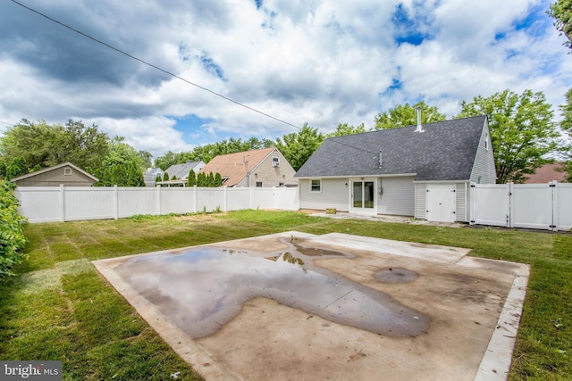 1102 Dolores Ln, Croydon, PA 19021 - back of property with a gate, a patio area, and roof with shingles