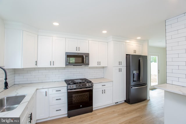 1102 Dolores Ln, Croydon, PA 19021 - kitchen with appliances with stainless steel finishes, a sink, white cabinetry, and recessed lighting
