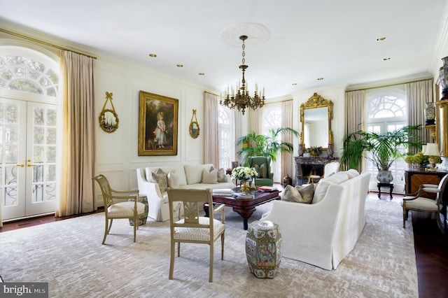 2838 Mcgill Ter NW, Washington, DC 20008 - living room featuring a chandelier, french doors, ornamental molding, and a decorative wall