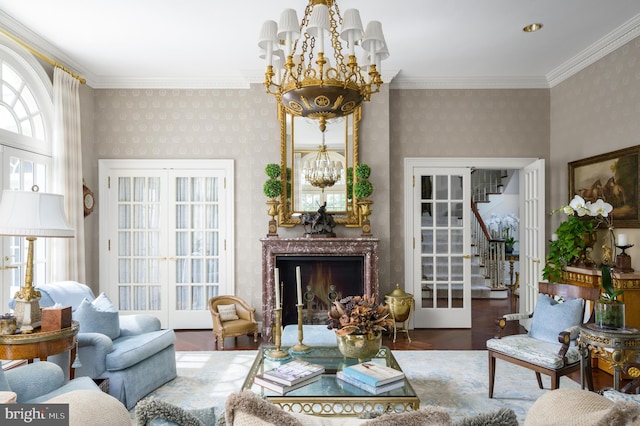 2838 Mcgill Ter NW, Washington, DC 20008 - living area featuring wallpapered walls, a chandelier, wood finished floors, stairs, and a high end fireplace