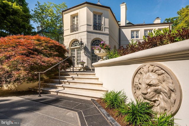 2838 Mcgill Ter NW, Washington, DC 20008 - view of front of home featuring stucco siding and a chimney