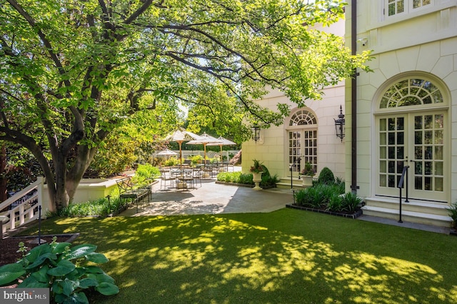 2838 Mcgill Ter NW, Washington, DC 20008 - view of grassy yard featuring french doors and a patio area