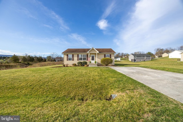 ranch-style house with a front lawn and driveway