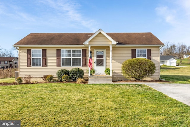 single story home with central AC unit and a front yard
