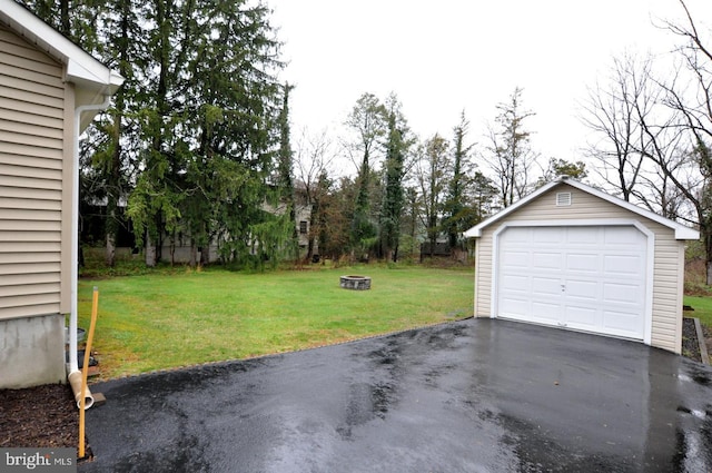 detached garage with aphalt driveway