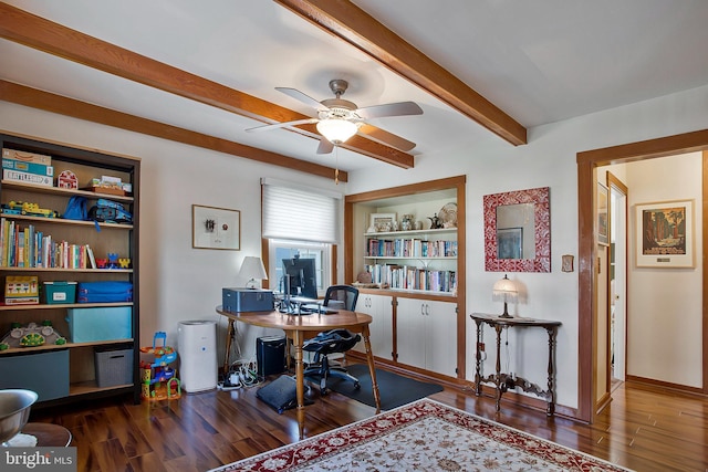 office area featuring built in features, beamed ceiling, a ceiling fan, wood finished floors, and baseboards