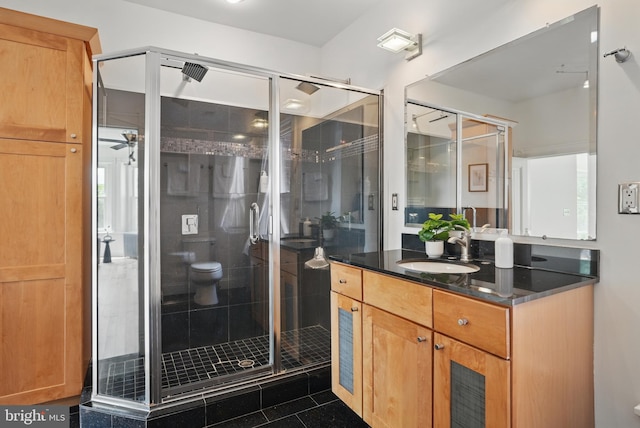 full bath featuring a shower stall, toilet, and vanity