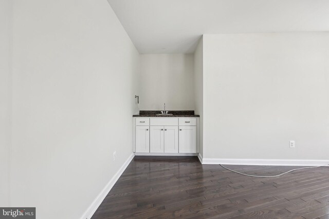 1905 S Glebe Rd, Arlington, VA 22204 - bar featuring baseboards, bar area, and dark wood finished floors