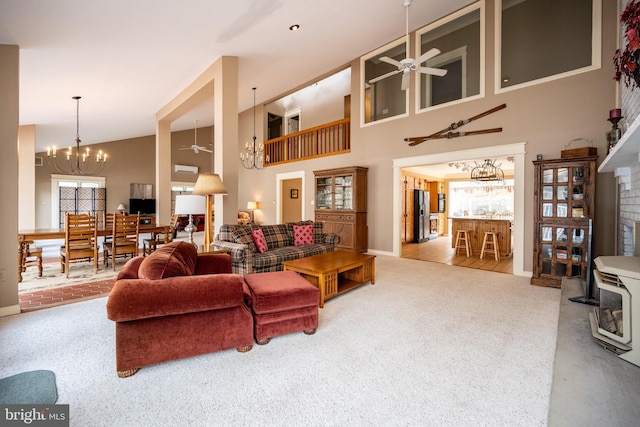 1909 Marsh Hill Rd, Mc Henry, MD 21541 - living room featuring a fireplace, high vaulted ceiling, carpet, and ceiling fan with notable chandelier