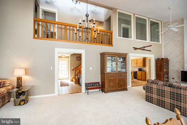 1909 Marsh Hill Rd, Mc Henry, MD 21541 - living room with carpet flooring, baseboards, a towering ceiling, stairway, and ceiling fan with notable chandelier